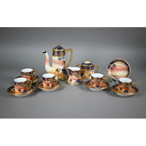 607 - A Noritake china coffee service, painted with dessert oasis scenes, comprising coffee pot, cream and... 