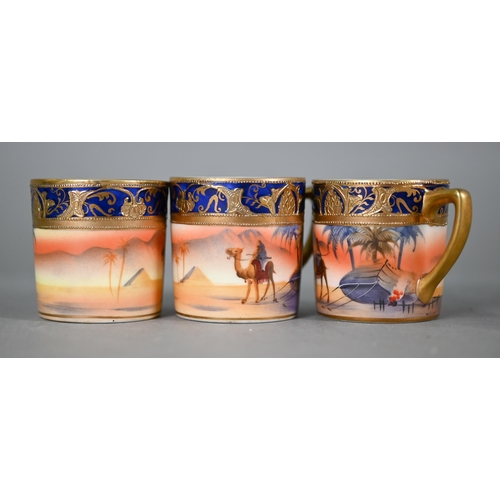 607 - A Noritake china coffee service, painted with dessert oasis scenes, comprising coffee pot, cream and... 