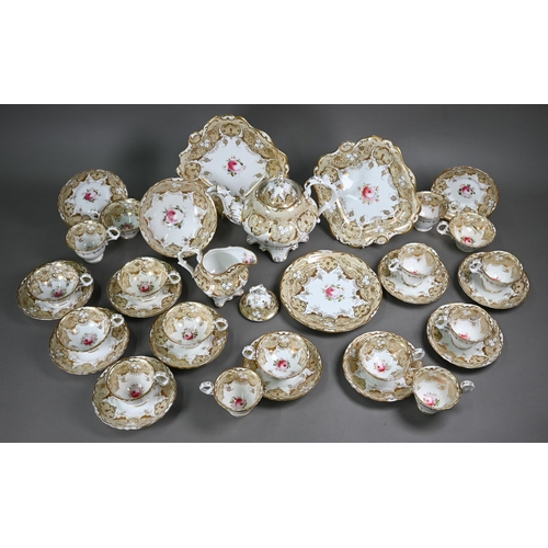 610 - A Victorian china tea service, painted with roses within a beige and gilt border, comprising a teapo... 