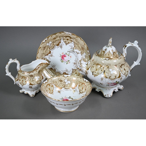 610 - A Victorian china tea service, painted with roses within a beige and gilt border, comprising a teapo... 