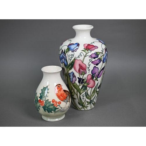 617 - A Moorcroft 'Sweetness' cream-ground vase, 24 cm to/w a smaller vase decorated with a Robin and Holl... 