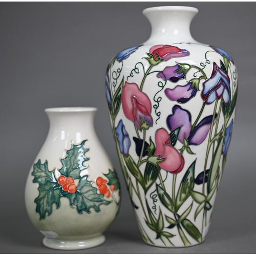 617 - A Moorcroft 'Sweetness' cream-ground vase, 24 cm to/w a smaller vase decorated with a Robin and Holl... 