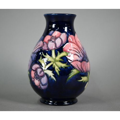 618 - A Walter Moorcroft 'Anenome' blue-ground vase, 19 cm high