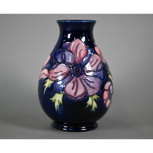 618 - A Walter Moorcroft 'Anenome' blue-ground vase, 19 cm high