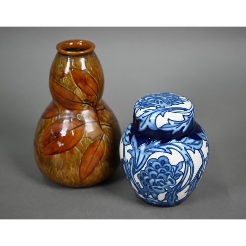 619 - A Moorcroft Kelmscott Artichoke ginger jar and cover, 11 cm, to/w a Royal Doulton stoneware Autumn L... 