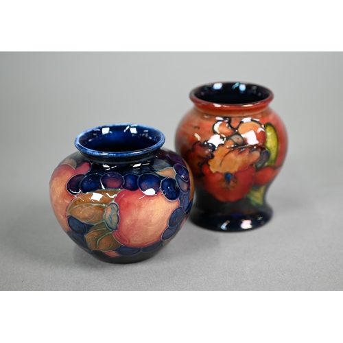 621 - A vintage Moorcroft small baluster vase, decorated with 'orchid' pattern on flambé ground, 8 cm to/w... 