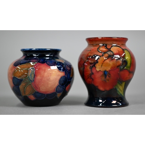 621 - A vintage Moorcroft small baluster vase, decorated with 'orchid' pattern on flambé ground, 8 cm to/w... 