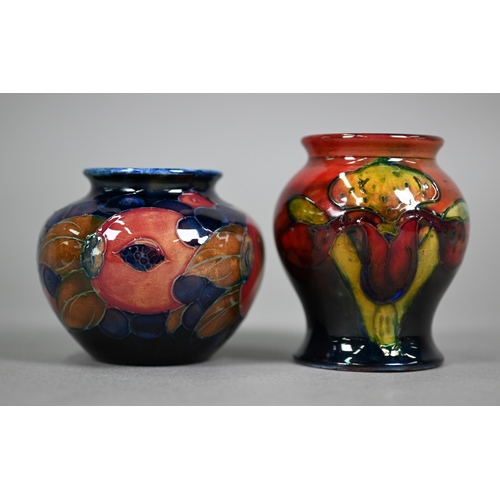 621 - A vintage Moorcroft small baluster vase, decorated with 'orchid' pattern on flambé ground, 8 cm to/w... 