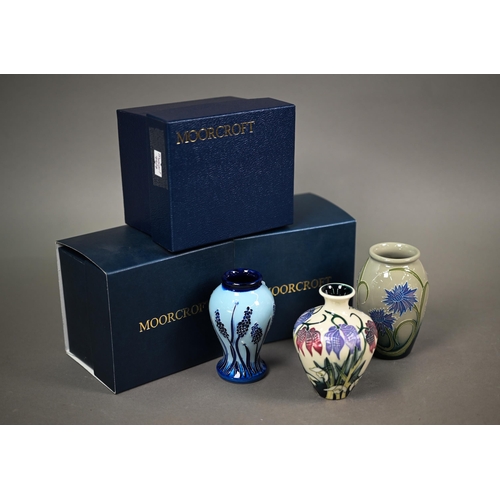 626 - Three boxed small Moorcroft vases, 'Alpine Meadow' 10 cm; 'Wild Cornflowers' 10 cm; and 'Muscari' 10... 