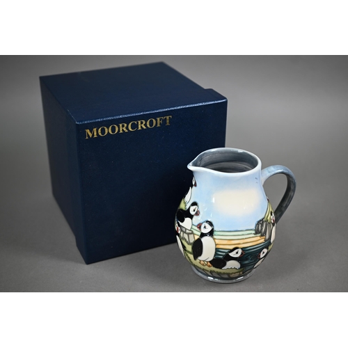 639 - A boxed Moorcroft 'Puffins' jug by Carol Lovett, 14 cm