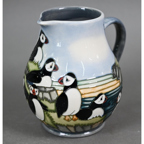 639 - A boxed Moorcroft 'Puffins' jug by Carol Lovett, 14 cm