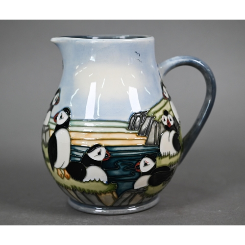 639 - A boxed Moorcroft 'Puffins' jug by Carol Lovett, 14 cm