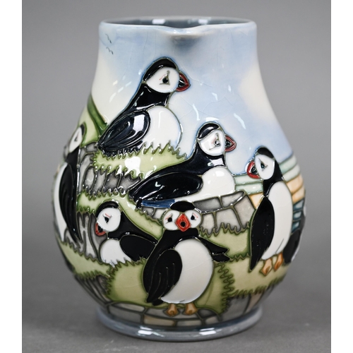 639 - A boxed Moorcroft 'Puffins' jug by Carol Lovett, 14 cm