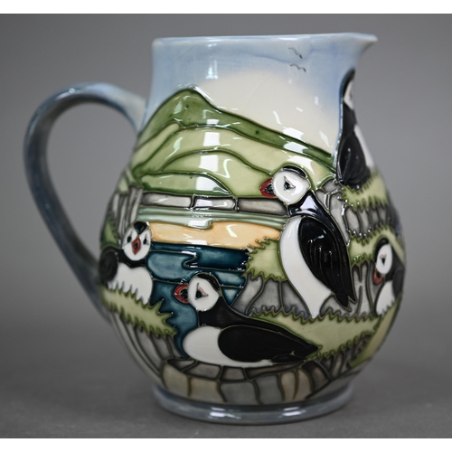 639 - A boxed Moorcroft 'Puffins' jug by Carol Lovett, 14 cm