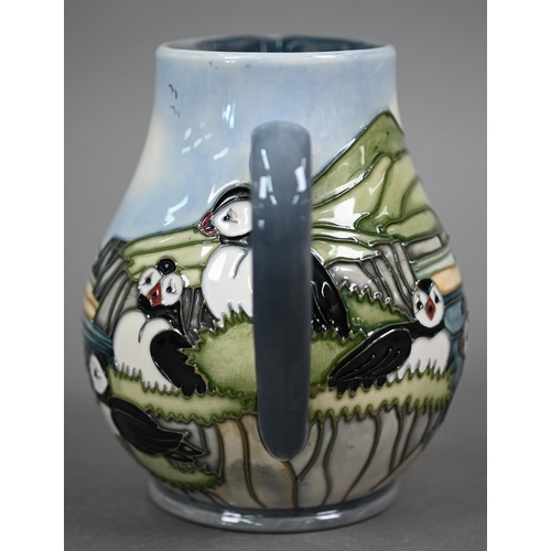 639 - A boxed Moorcroft 'Puffins' jug by Carol Lovett, 14 cm