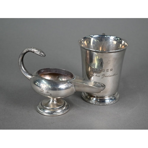 64 - A small silver Christening mug, Birmingham 1935, to/w a small Aladdin's lamp style table lighter (in... 