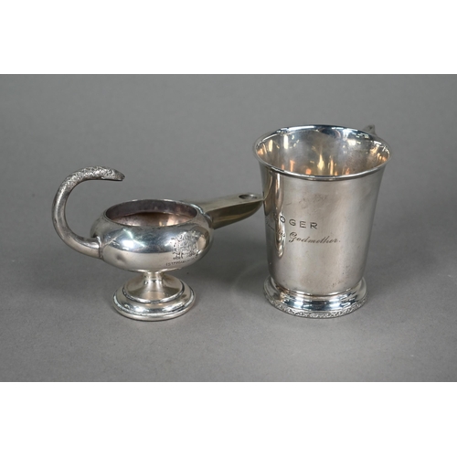 64 - A small silver Christening mug, Birmingham 1935, to/w a small Aladdin's lamp style table lighter (in... 