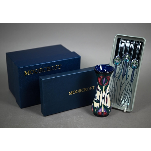 651 - A boxed Moorcroft 'Peacock Parade' pin-tray by Nicola Slaney, 2012, 20 x 9 cm to/w a boxed 'Mackinto... 