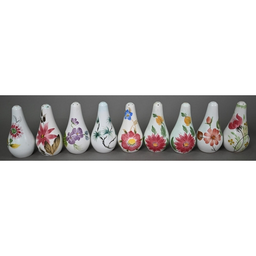 658 - A selection of E Radford floral-painted condiments, including salts, peppers and oil-ewers, to/w oth... 