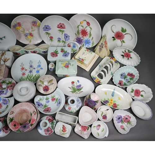 664 - A collection of E Radford butter dishes, toast rack, candlesticks, wall-pockets, plates, dishes, pos... 