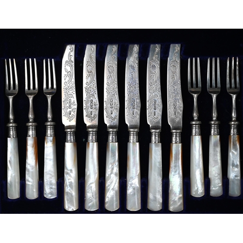 71 - An Edwardian oak-cased set of twelve each silver dessert knives and forks with engraved blades and m... 