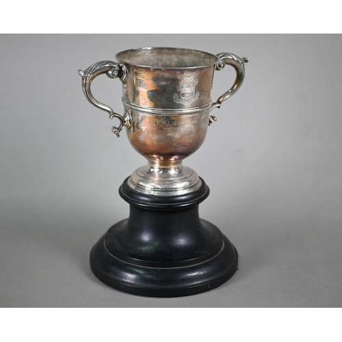 72 - A Georgian unmarked silver loving cup with twin scroll handles, on stemmed foot, makers mark only WT... 