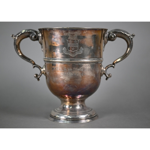 72 - A Georgian unmarked silver loving cup with twin scroll handles, on stemmed foot, makers mark only WT... 