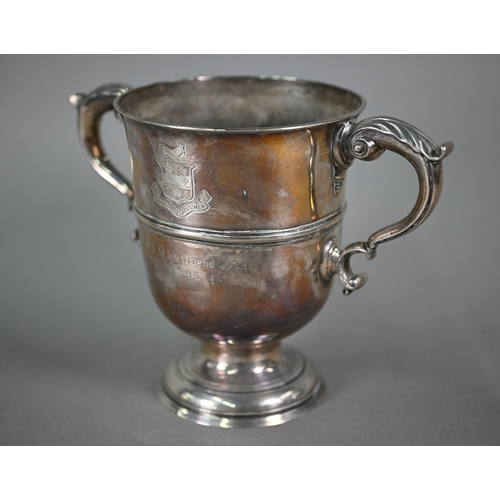 72 - A Georgian unmarked silver loving cup with twin scroll handles, on stemmed foot, makers mark only WT... 