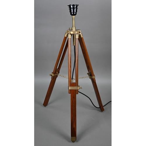 80 - A mid-20th century wooden and brass telescopic tripod converted to a table lamp, with an off-white c... 