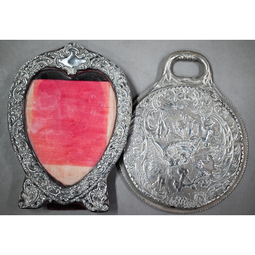 88 - A late Victorian silver hand-mirror, London 1899, to/w a heart-shaped easel photograph frame, Birmin... 