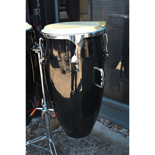 90 - A good pair of conga drums, with central stand, each drum 75 cm high