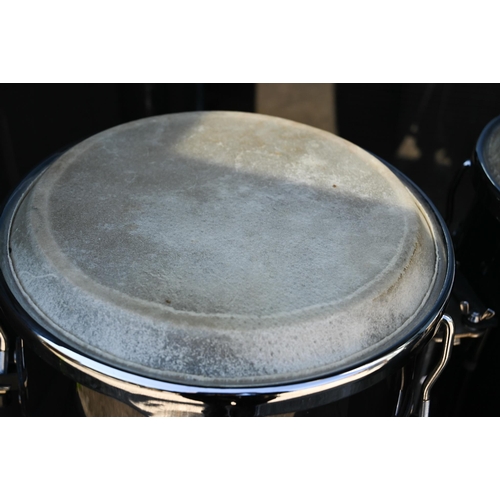 90 - A good pair of conga drums, with central stand, each drum 75 cm high