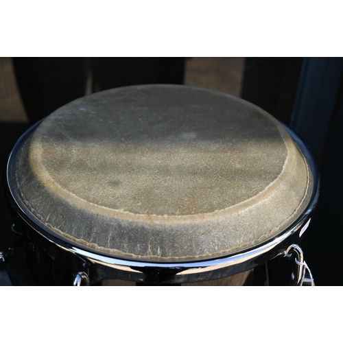 90 - A good pair of conga drums, with central stand, each drum 75 cm high