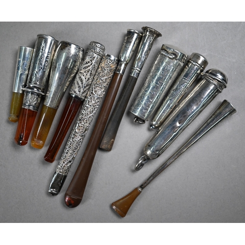 1069 - A collection of cheroot/cigarette holders including a 'Jazz Age' telescopic example extending to 104... 