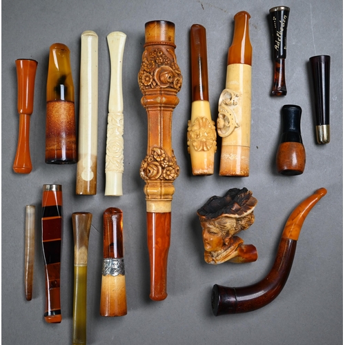 1069 - A collection of cheroot/cigarette holders including a 'Jazz Age' telescopic example extending to 104... 