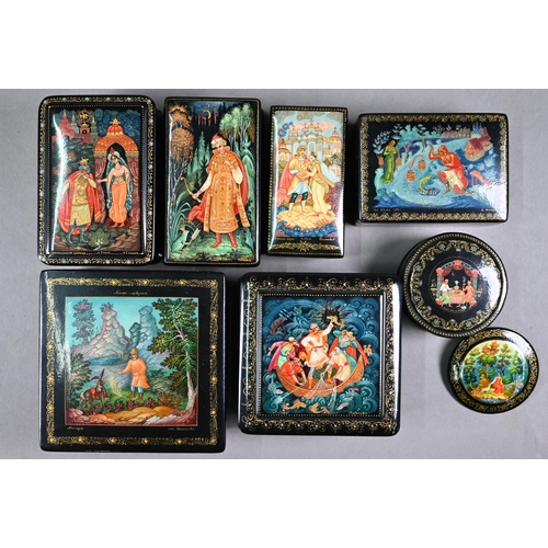 1078 - Seven Russian kholui lacquer boxes and a brooch, painted in miniature with scenes from traditional s... 