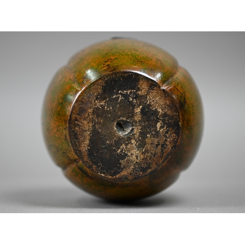 1081 - A turned and carved wood tea caddy in the form of a melon, 12.5 cm high