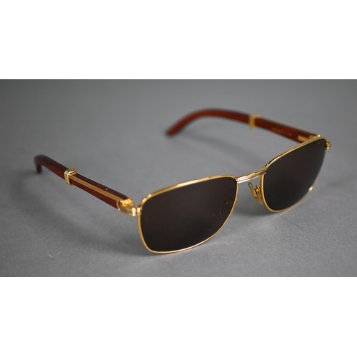 1083 - A boxed pair of Cartier C Decor 140B sunglasses with babinga wood arms (little used)