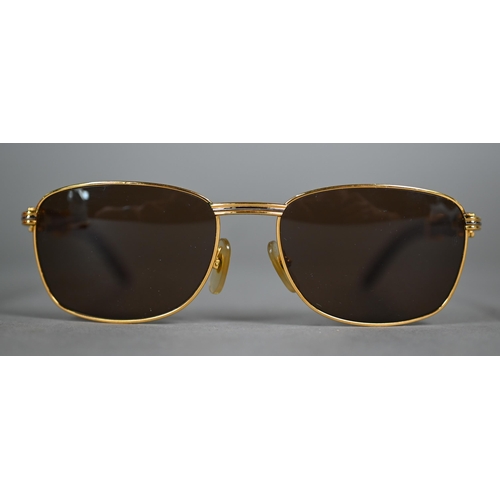 1083 - A boxed pair of Cartier C Decor 140B sunglasses with babinga wood arms (little used)