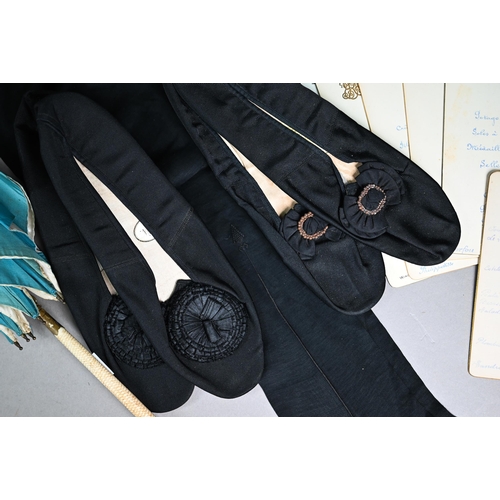 1087 - A pair of black silk stockings, the property of Queen Victoria, with drawn thread crowned 'VR' cyphe... 