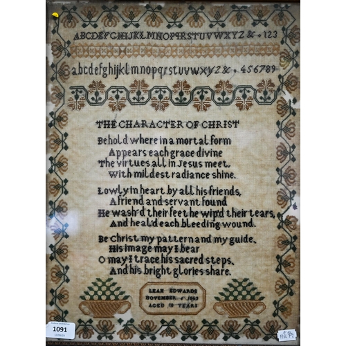 1091 - A Victorian needlework sampler, worked with alphabets, numbers, religious verses and fruit-baskets, ... 