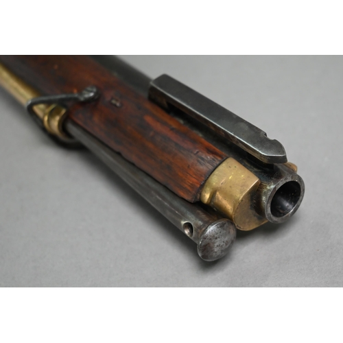 1131 - A replica Georgian flintlock 'Brown Bess' musket, the 78.5 cm barrel with bayonet mounting-clip, on ... 