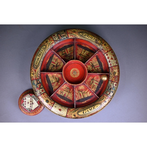 1147 - 19th century papier maché 'Pope Joan' game, with revolving segmented bowl, gilt decorated on a red g... 