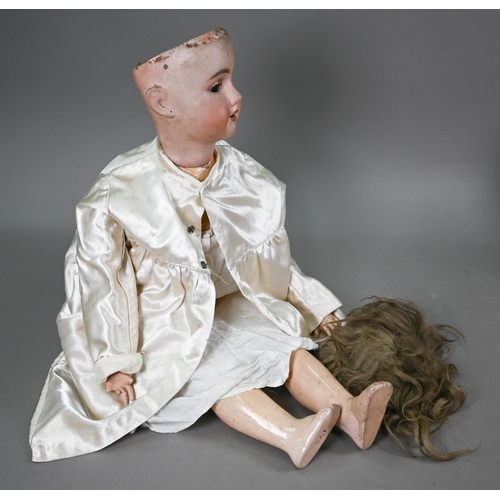 1163 - A large Arnoldia 13 bisque-headed girl doll with blond wig, closing brown eyes, open mouth with five... 