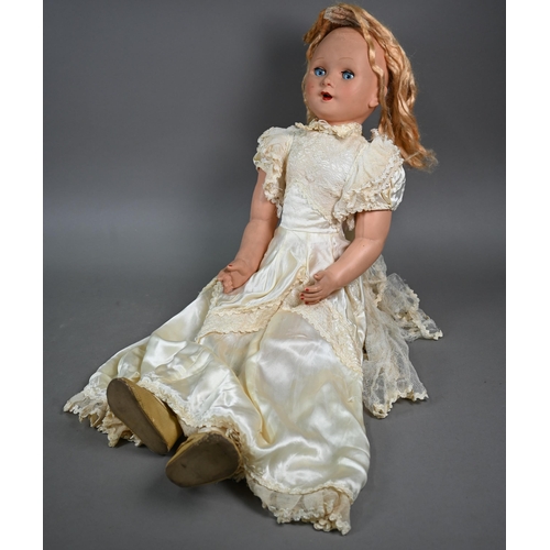 1163 - A large Arnoldia 13 bisque-headed girl doll with blond wig, closing brown eyes, open mouth with five... 