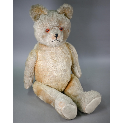 1164 - A large vintage mohair teddy bear with glass eyes and stitched nose, swivelling head and limbs, 80 c... 