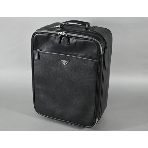 1185 - A Prada carry-on suitcase, with wheels and trolley-handle, nylon and Saffiano leather exterior, full... 