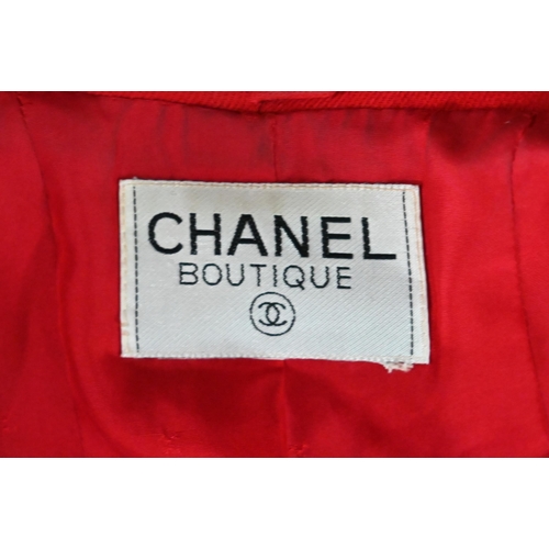 1188 - A Chanel Boutique jacket in red wool, long line with double collar, single breasted with four open p... 