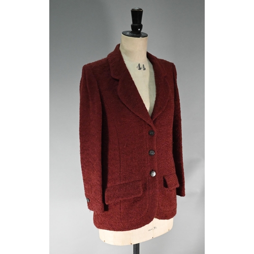 1189 - A Chanel Boutique fitted burgundy jacket in wool and mohair, long line, single breasted with two low... 