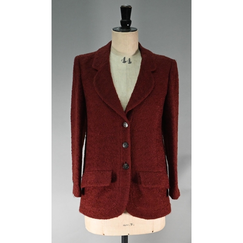 1189 - A Chanel Boutique fitted burgundy jacket in wool and mohair, long line, single breasted with two low... 